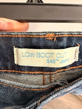 Levi's dark blue denim low boot cut jeans with orange stitching